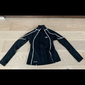 North face running jacket with reflective accent. Size medium